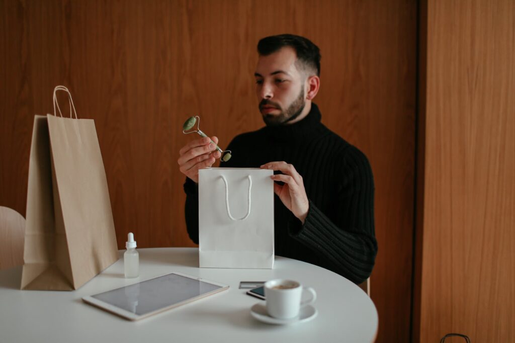 guy looking at lotion bottle